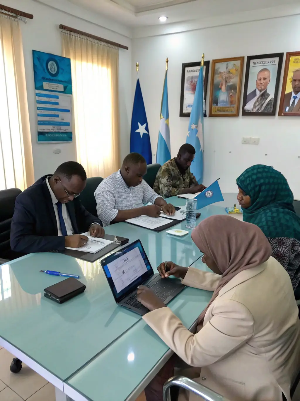 A group of NGO representatives in a meeting, discussing compliance and accreditation standards with a CONTINENTAL STANDARDS COMMISSION official.