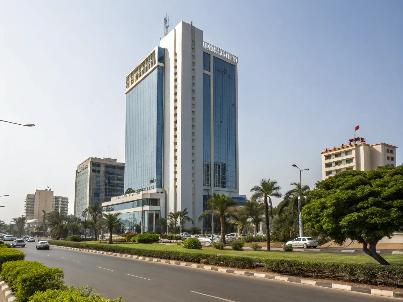 An image of a modern office building in an African city, with a banner displaying the Continental Standards Commission logo and the words "Accredited Business."